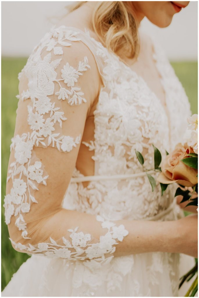 bride in long sleeve lace gown on wedding day in nebraska