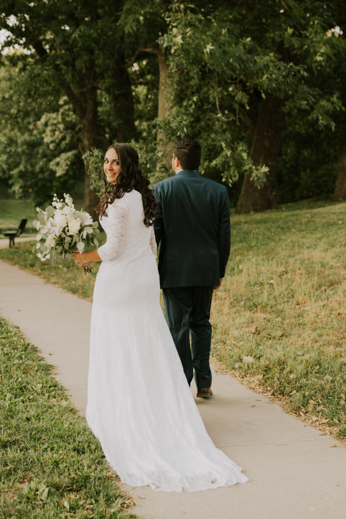 bride and groom walking away after louisville bridals session