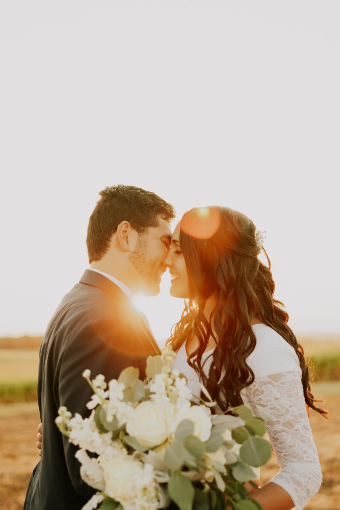 bride and groom kissing during golden hour bridals session in Louisville
