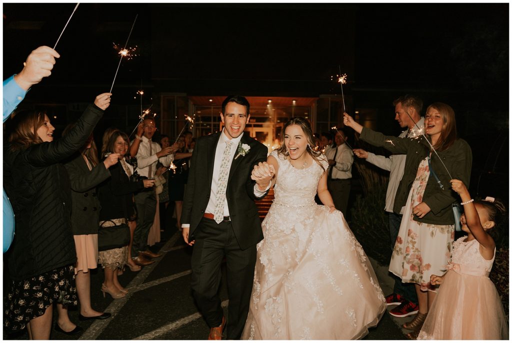 bride and groom walking out during sparkler exit after wedding ceremony