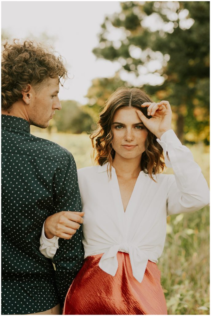 couple posing in omaha forest 