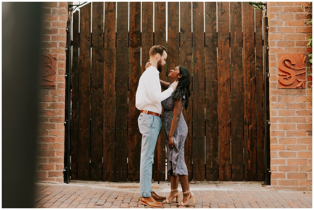 couple posing during downtown omaha engagement session