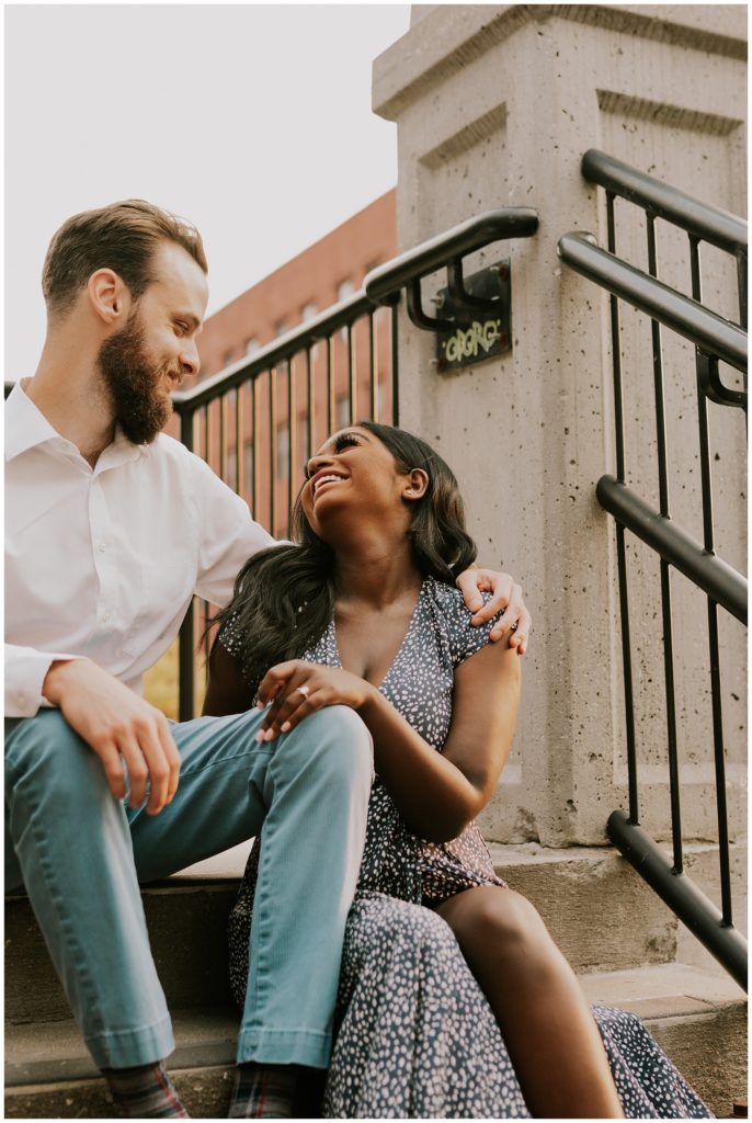 couple hugging and laughing in omaha engagement shoot