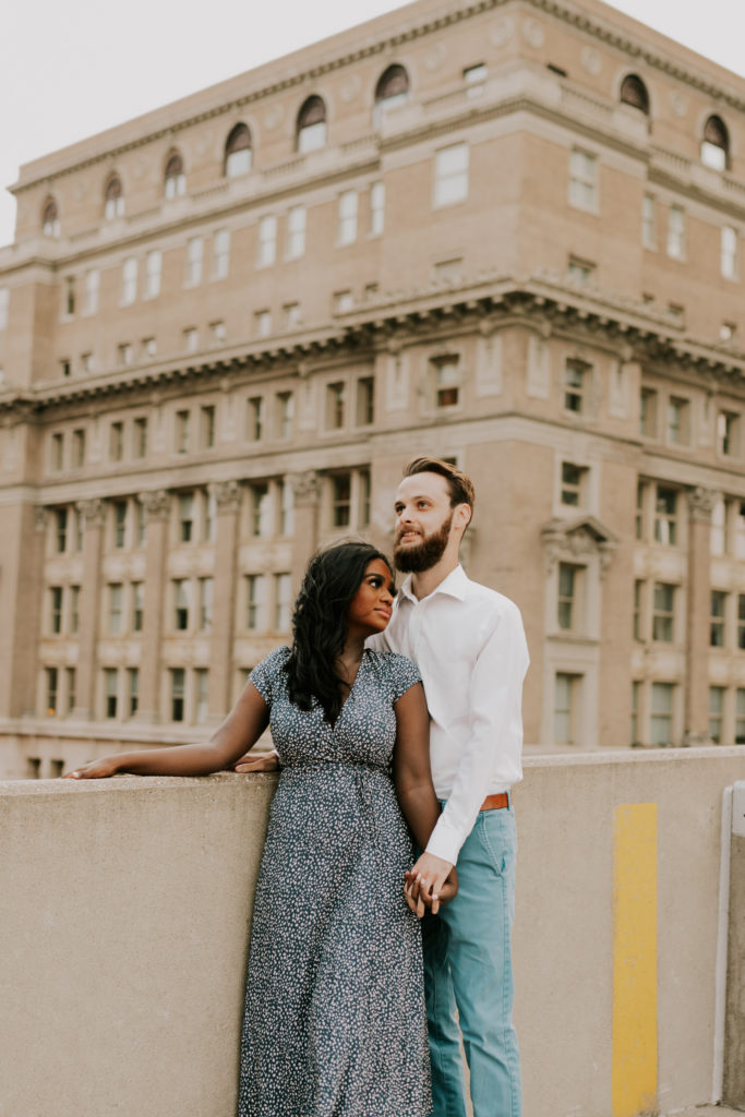 couple posing during downtown omaha engagement session 