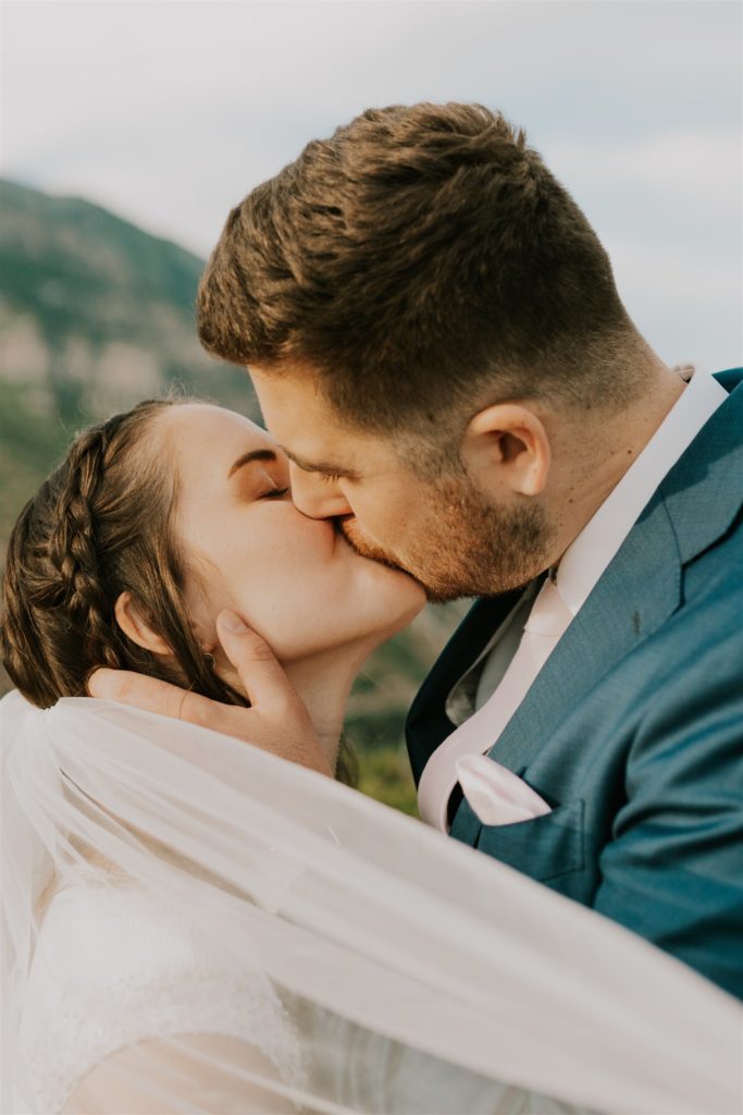 bride and groom kissing during anniversary session in utah valley