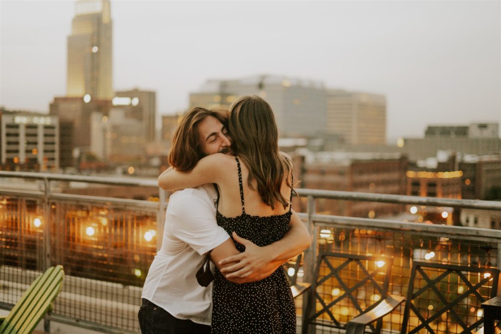 man and woman hugging in downtown omaha 