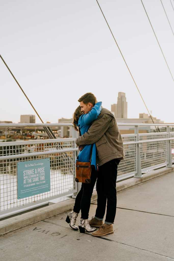 man and woman hugging after recent proposal in omaha