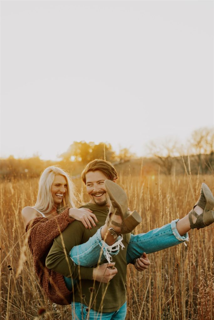 man and woman posing during outdoor engagement session
