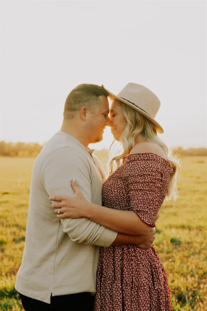 man and woman hugging nose to nose during gretna fall engagement session