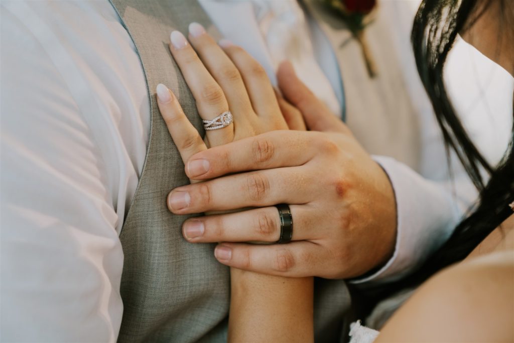 bride and groom holding hands on wedding day as husband and wife in omaha wedding
