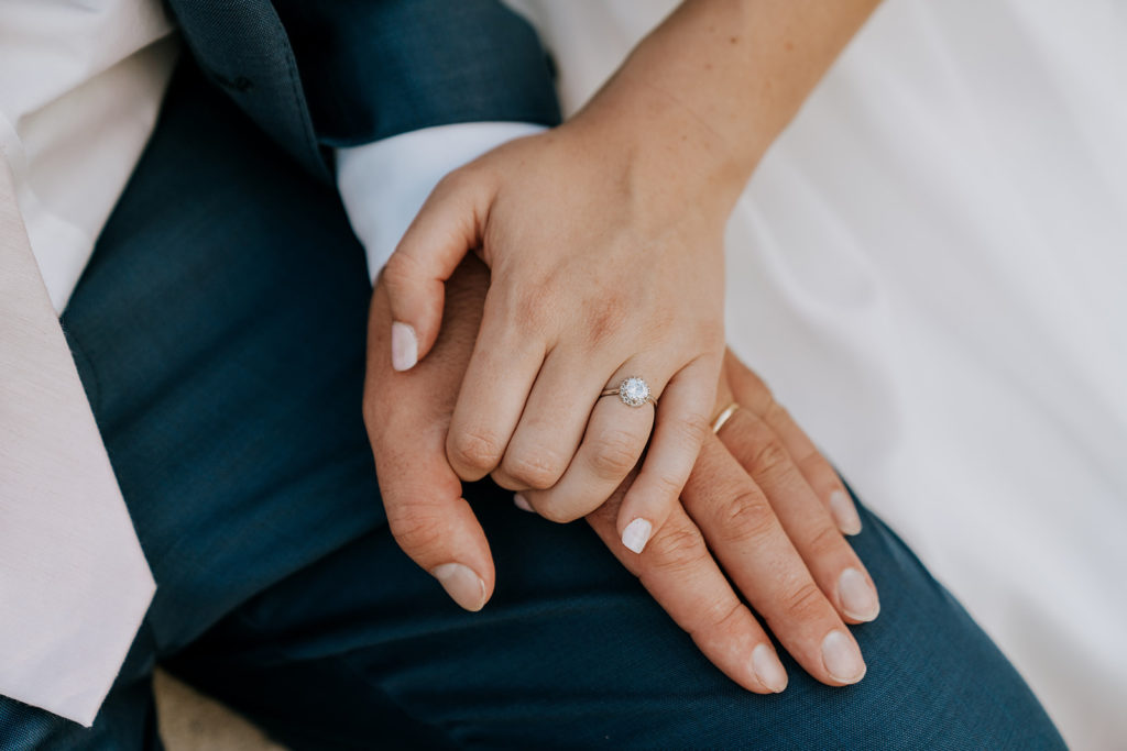 bride and groom holding hands after recent marriage