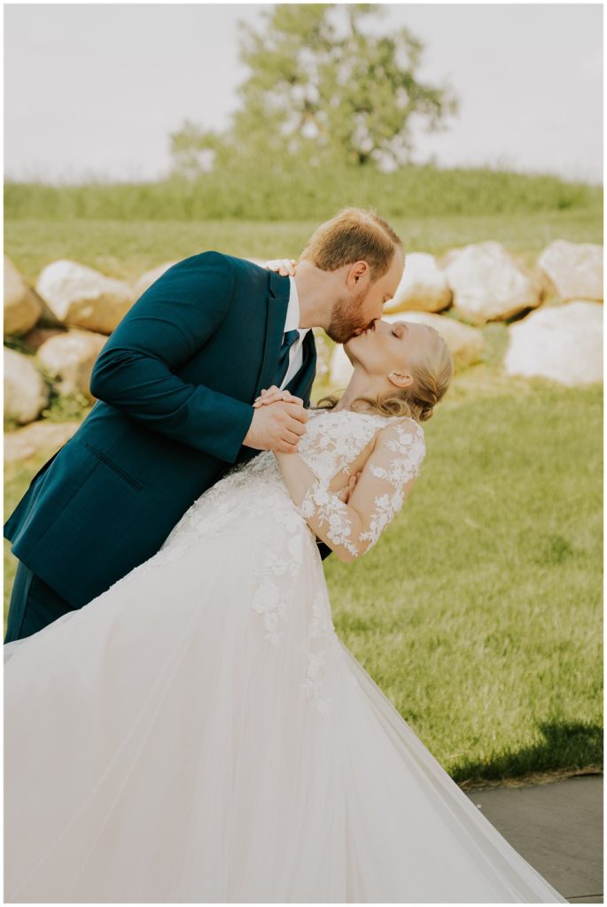 bride and groom kissing after wedding ceremony in nebraska
