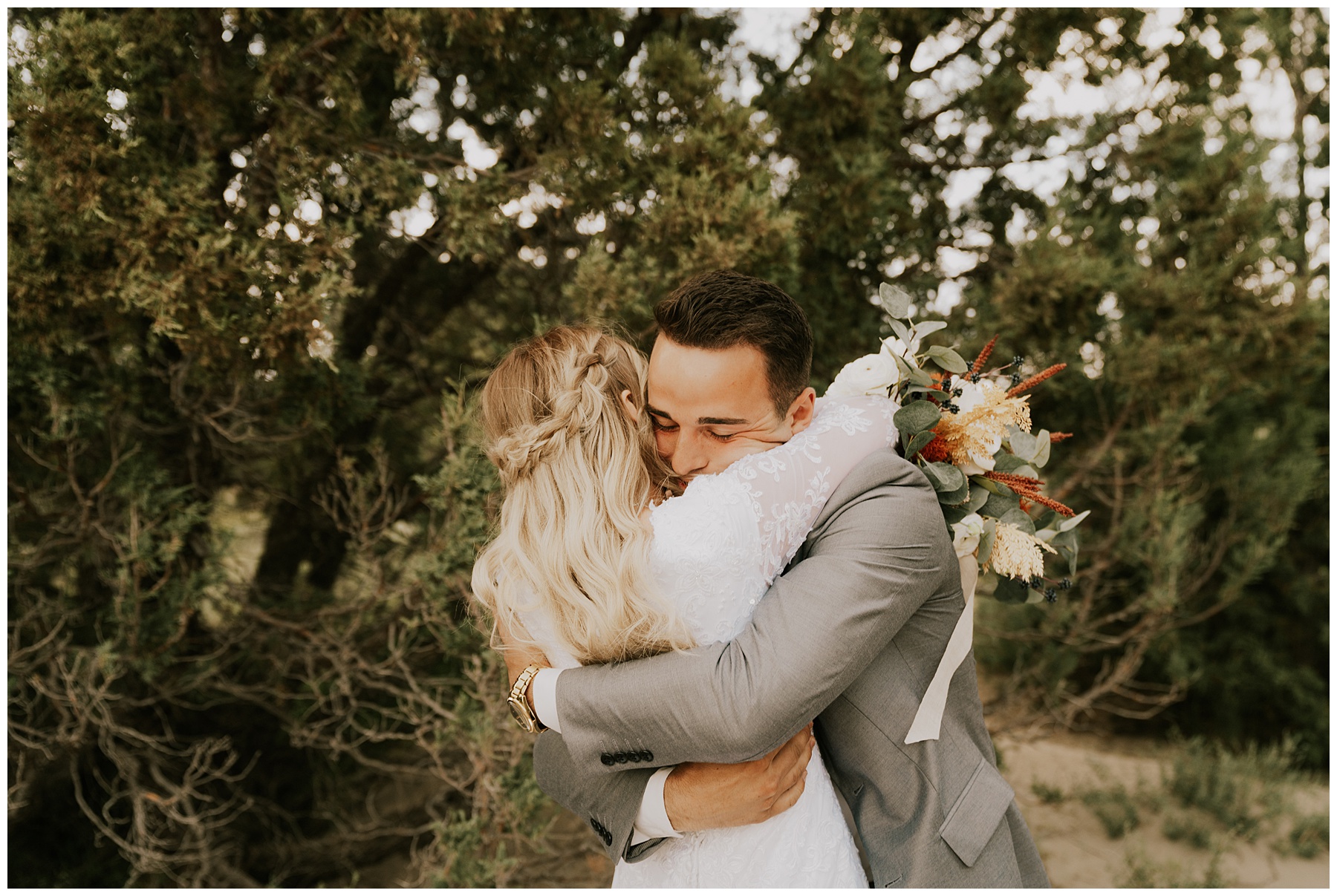bride hugging groom after their first look in omaha forest bridals session