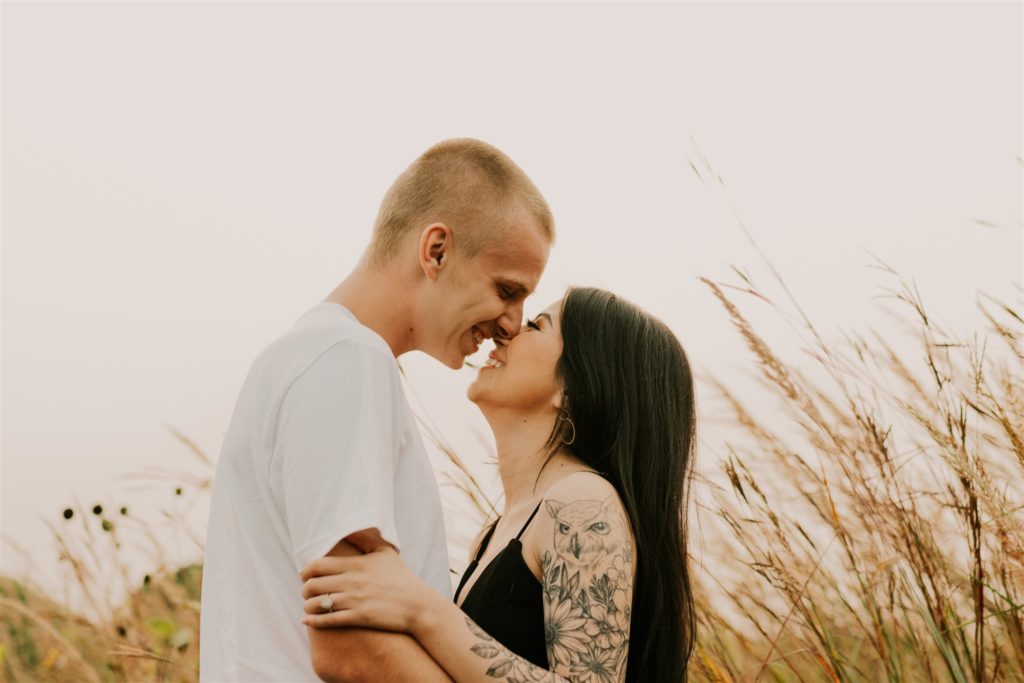 couple kissing during fall outdoor session