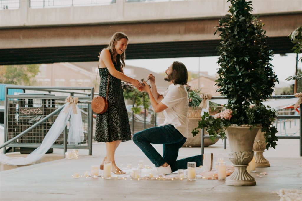 man proposing to woman in downtown Omaha