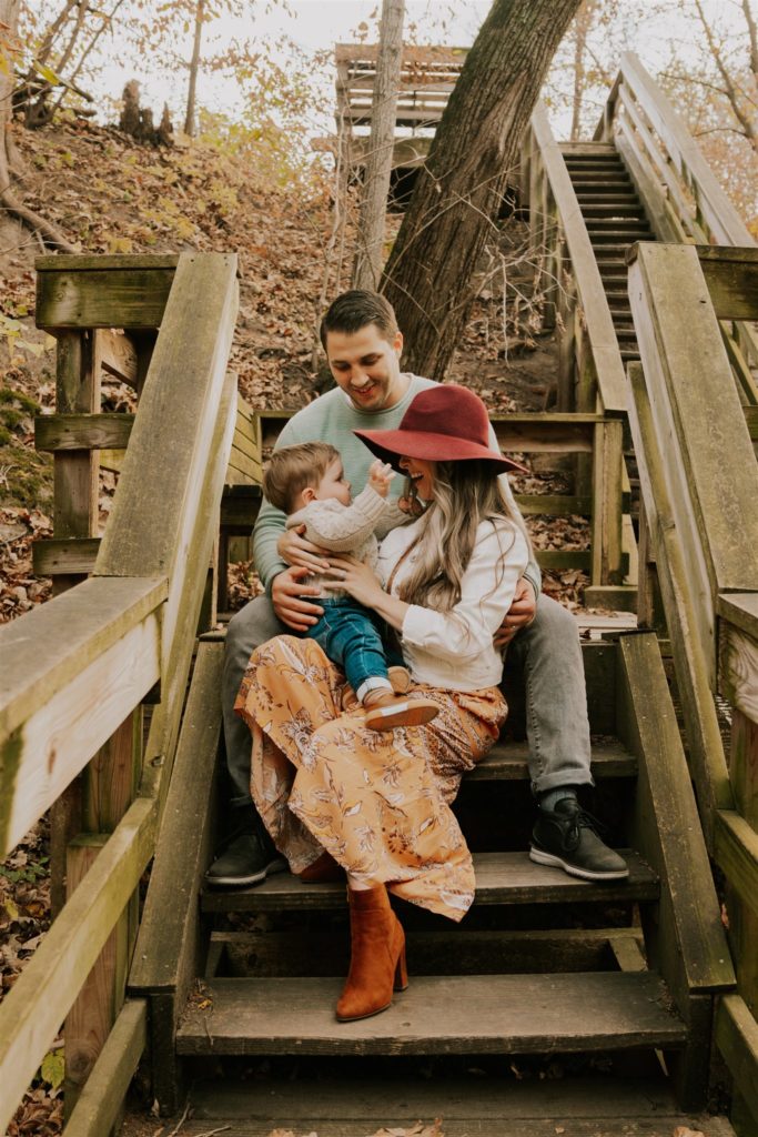 family posing on stairs in omaha fall session