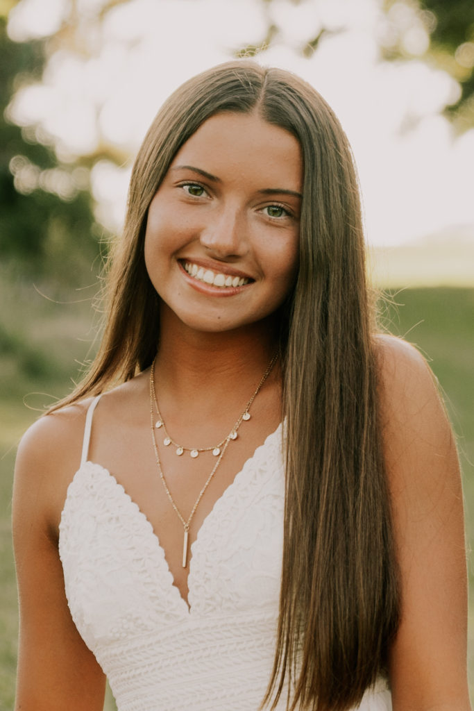 woman posing and smiling during omaha senior session 